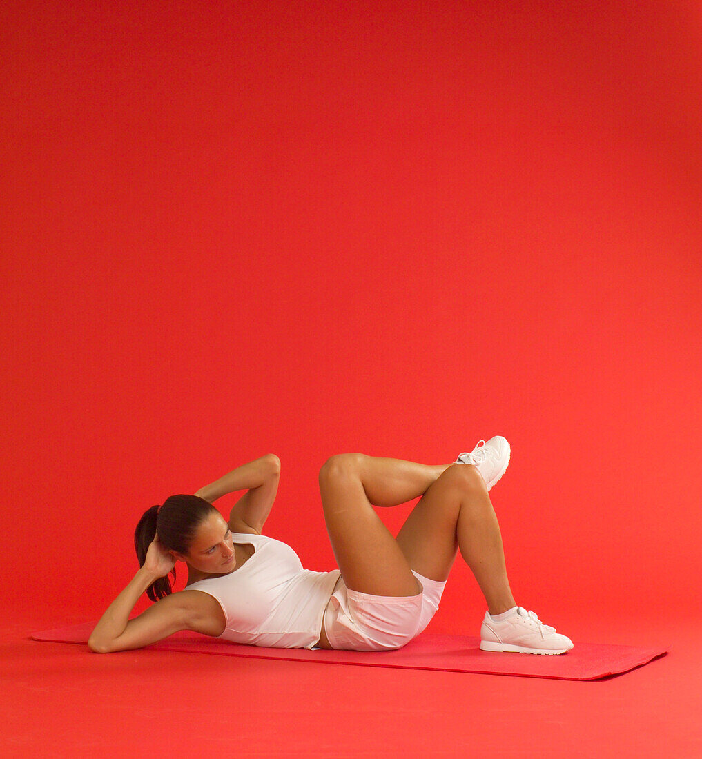 Woman exercising abdominals