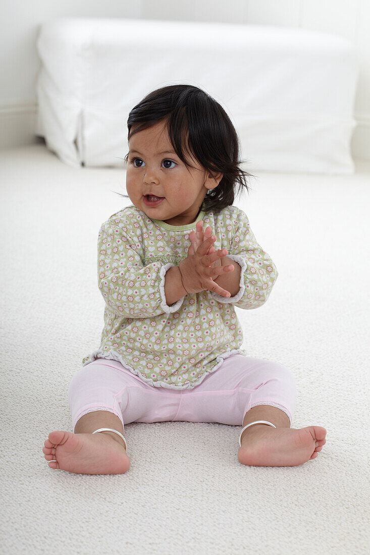 Baby girl clapping her hands