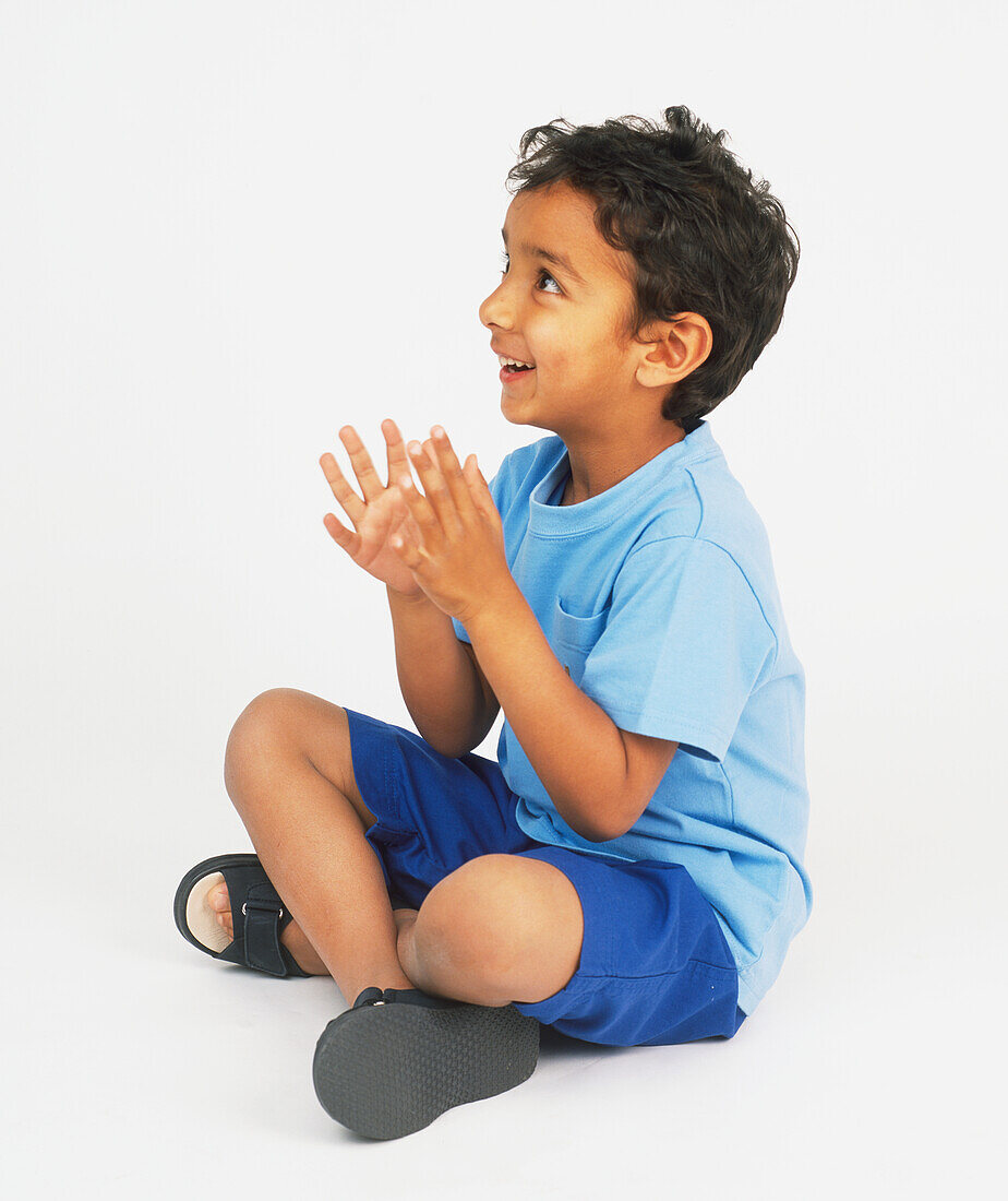 Boy clapping hands