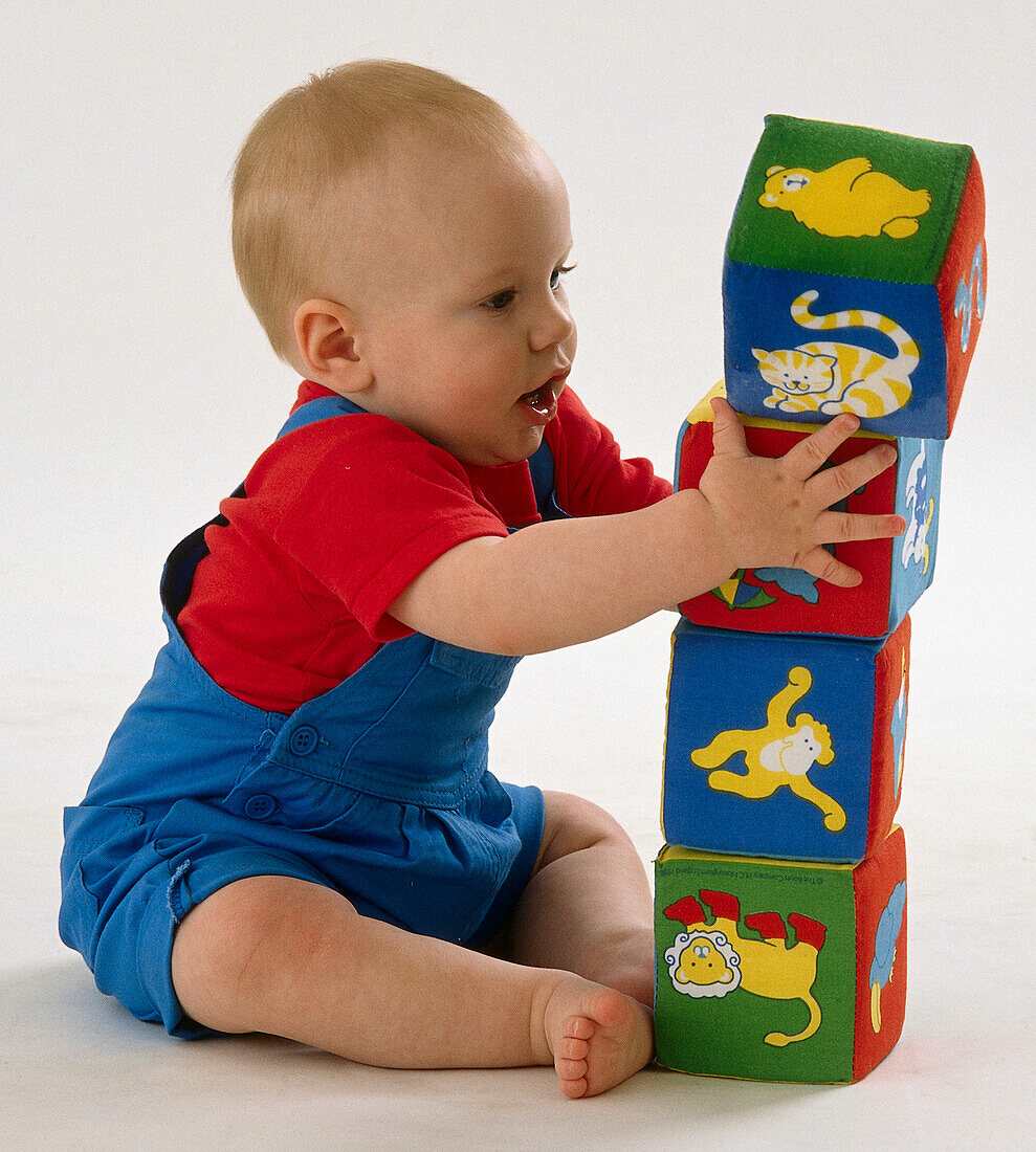 Baby building tower with building blocks