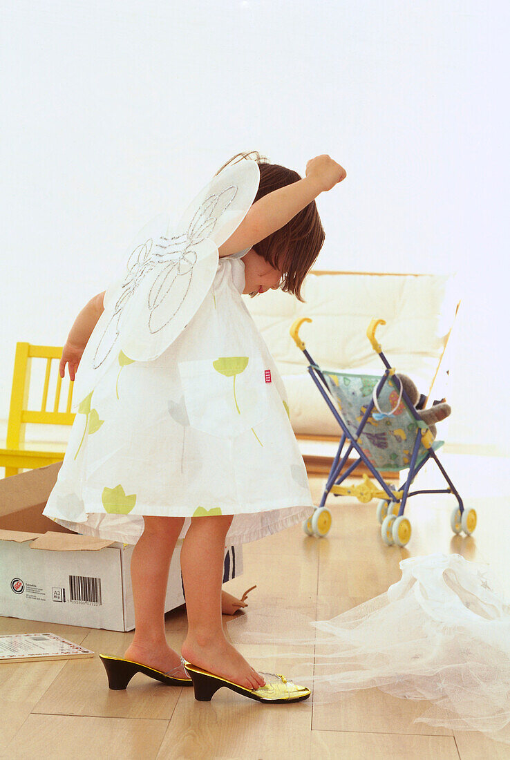 Girl toddler playing dress-up