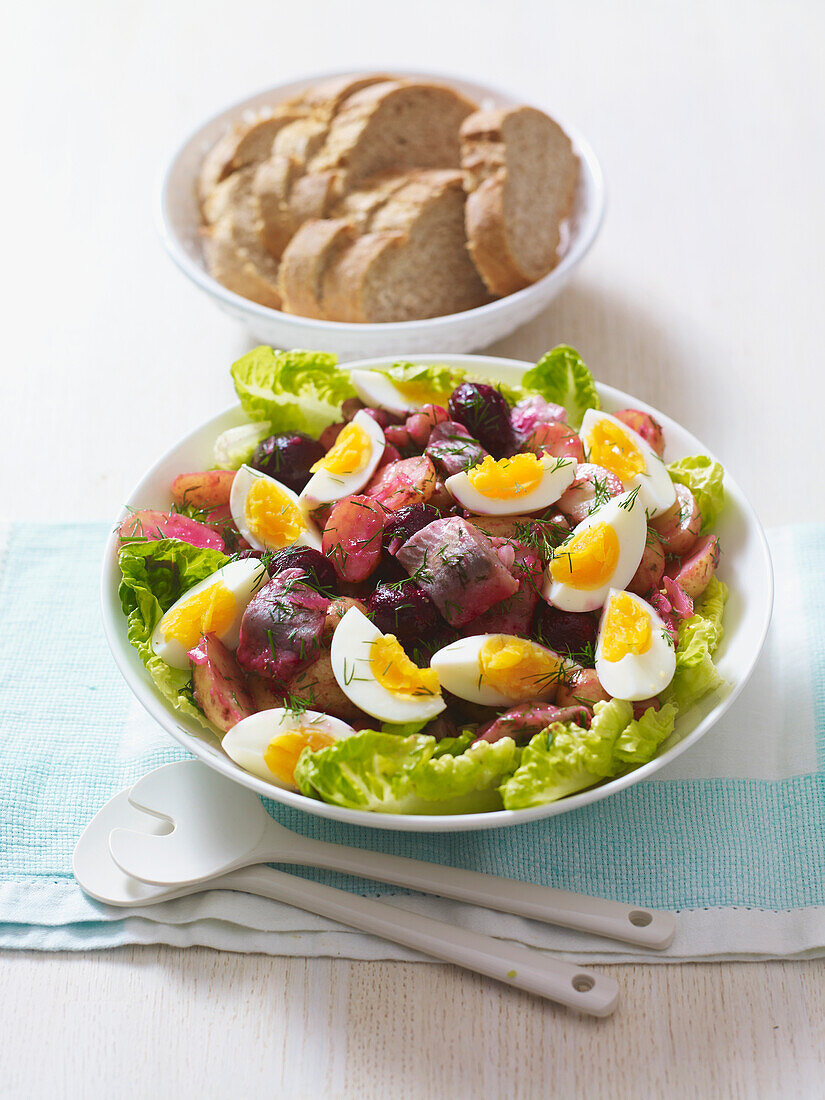 Warm herring and boiled egg salad