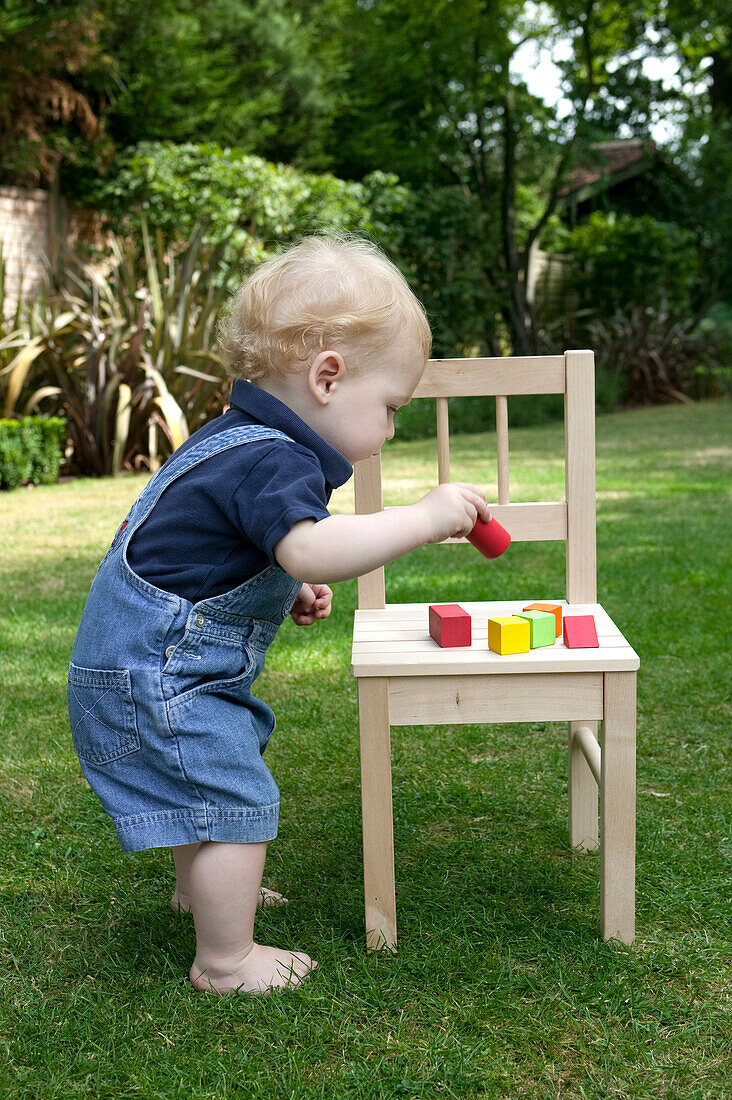 Baby boy playing with building blocks