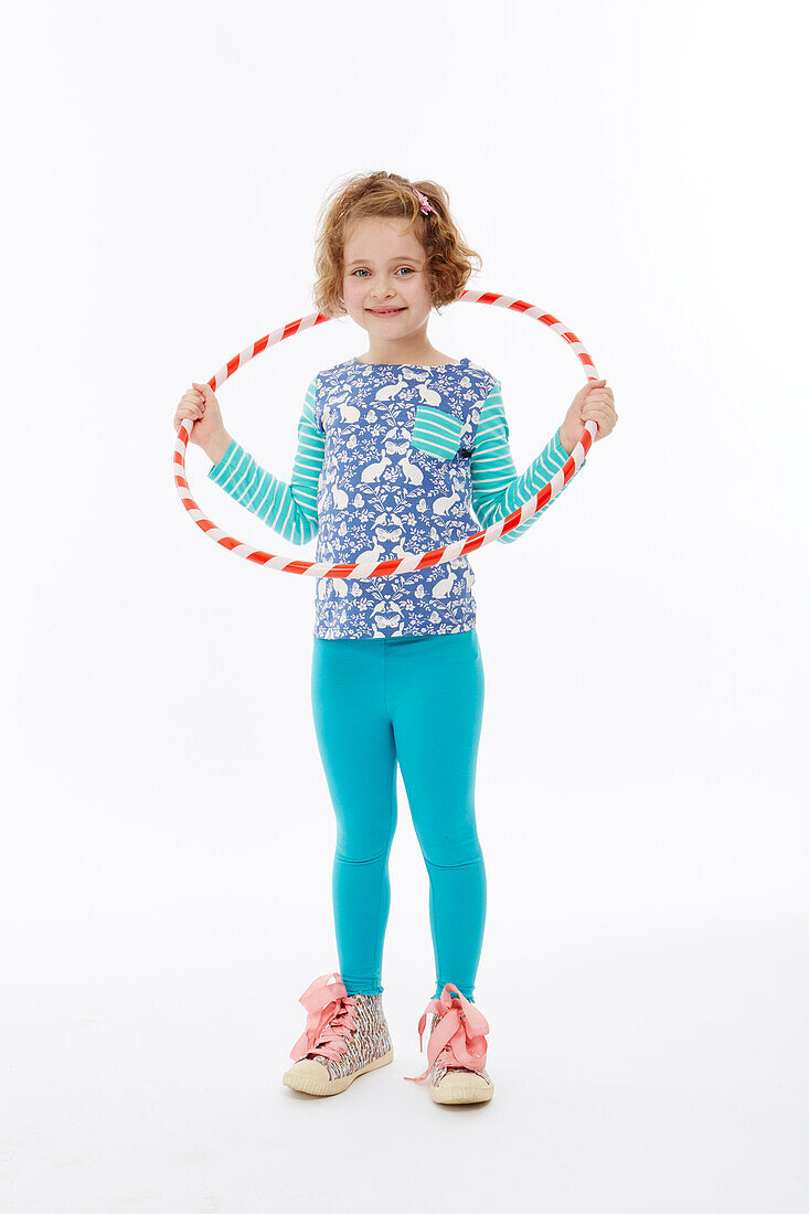 Girl playing with hula-hoop