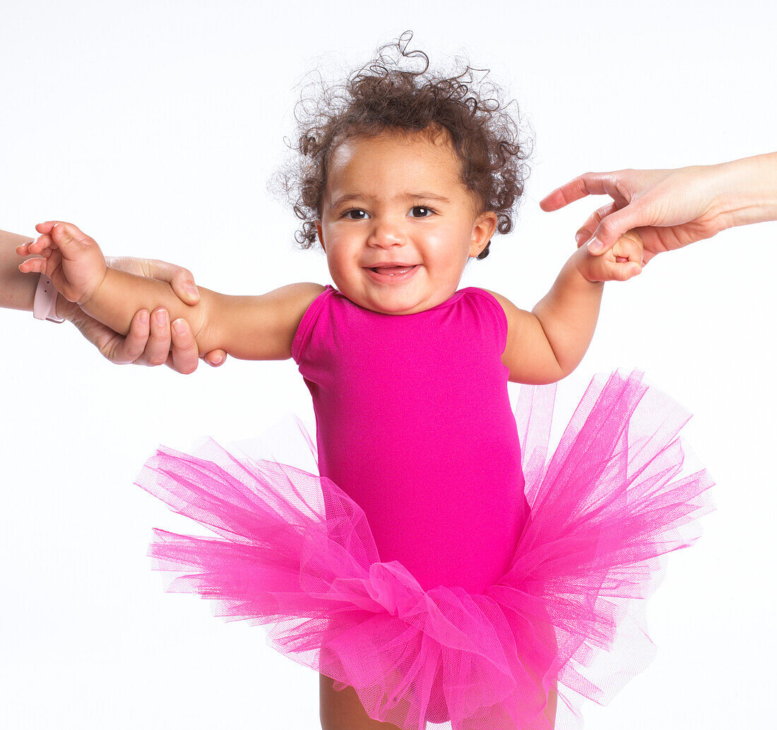 Baby girl wearing pink leotard and pink tutu