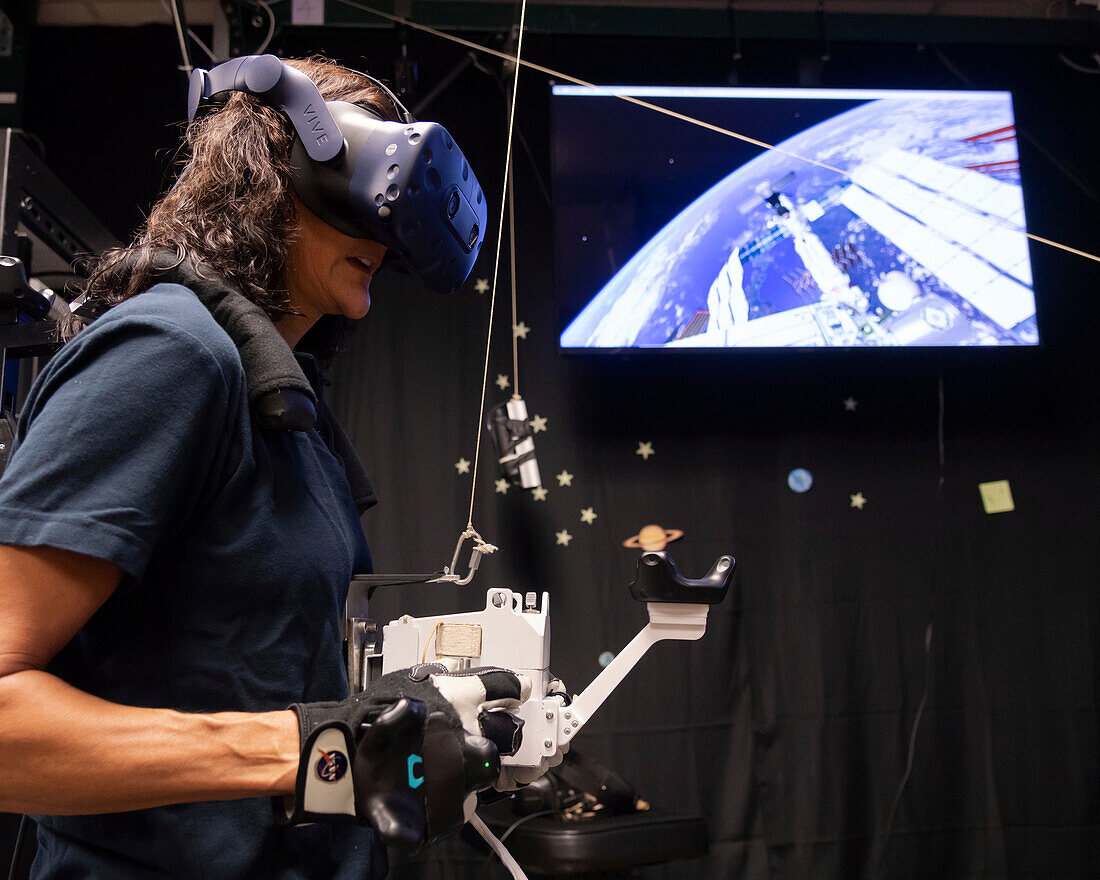 NASA astronaut practising spacewalk using virtual reality