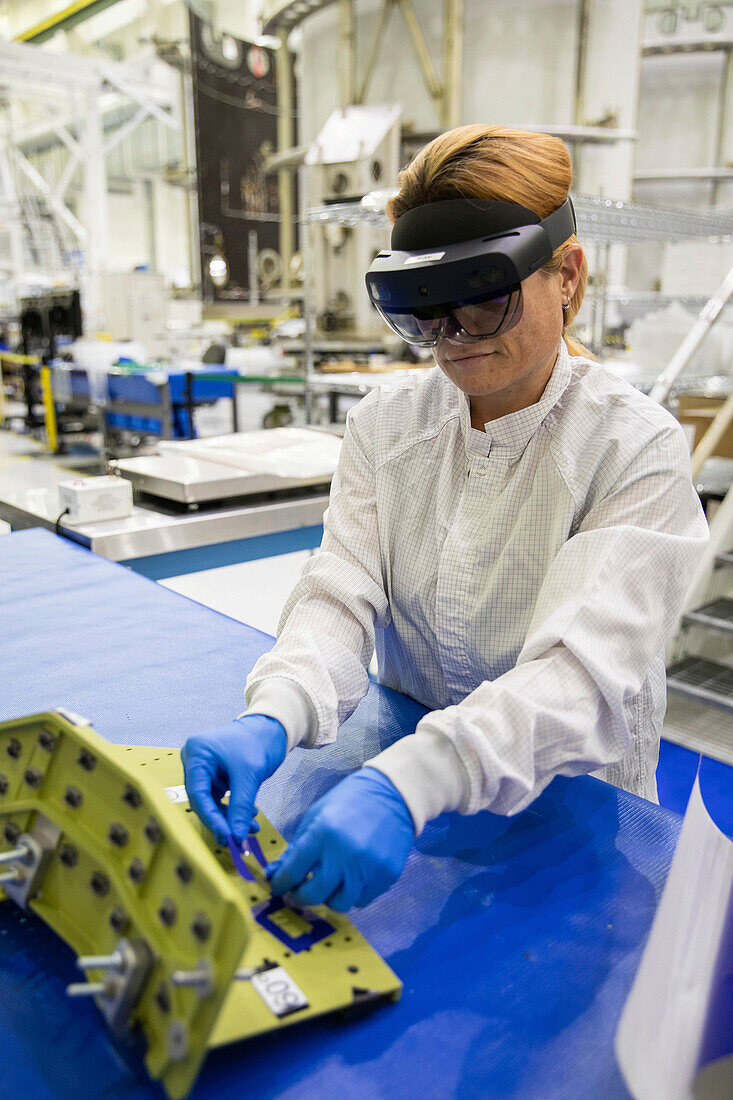 Technician using augmented reality goggles