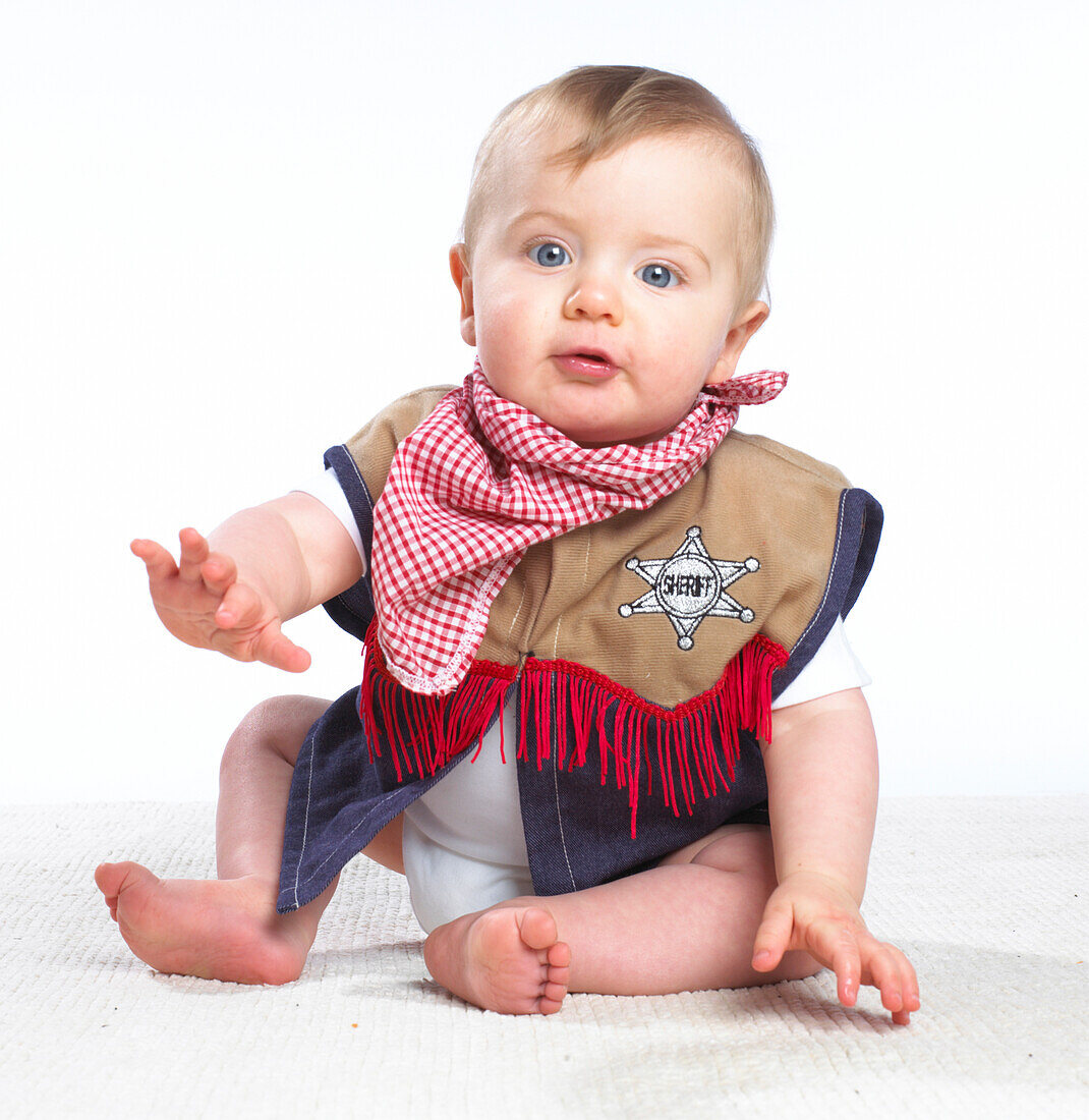 Baby boy wearing sheriff's costume