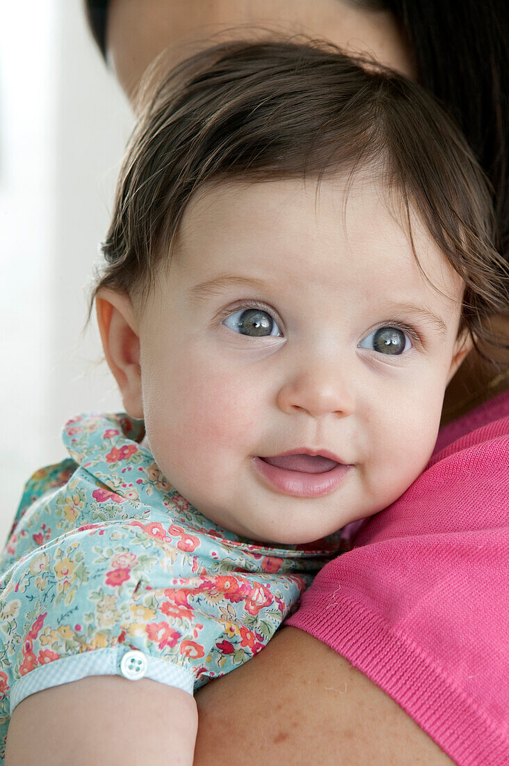 Baby girl in woman's arms