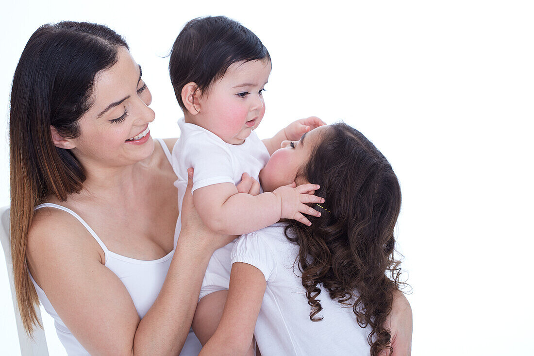 Baby with her sibling and mother