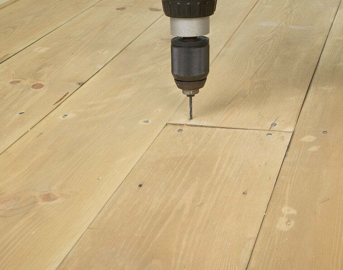 Drilling a hole in to a floor board