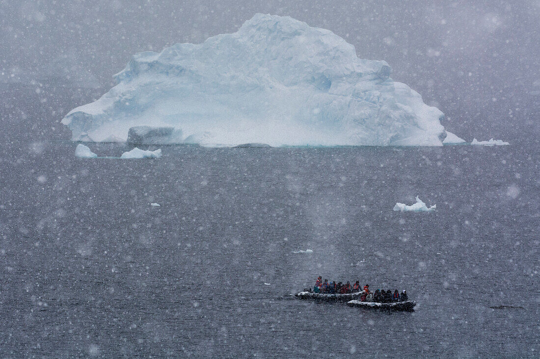 Snowstorm over iceberg, Portal Point, Antarctica