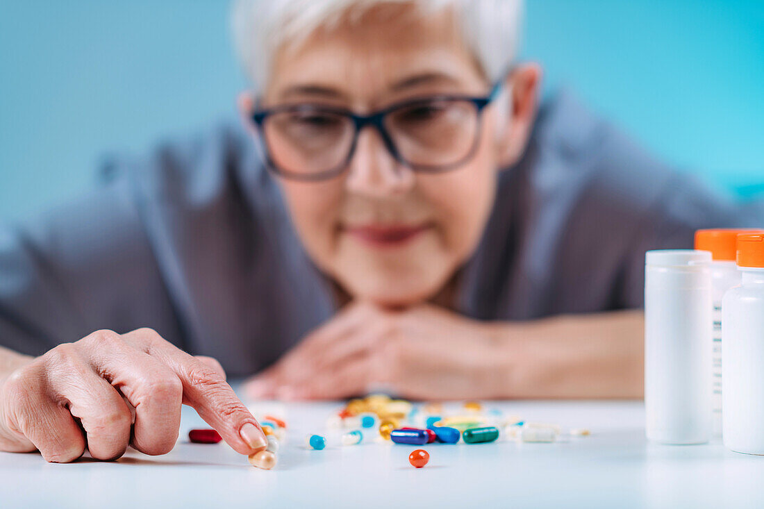 Senior patient counting pills