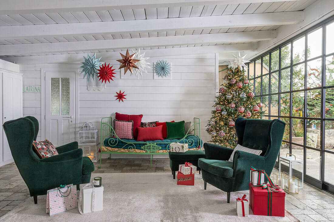 Living room decorated for Christmas with tree and presents