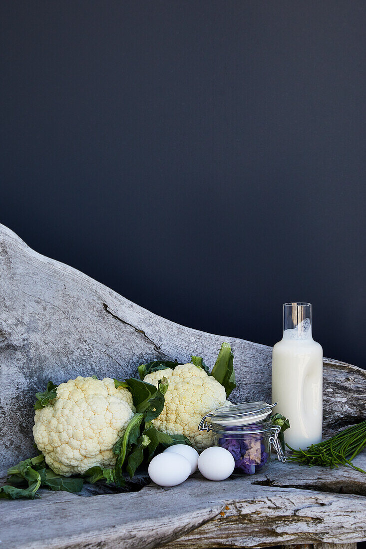 Ingredients for poached egg with white and purple cauliflower