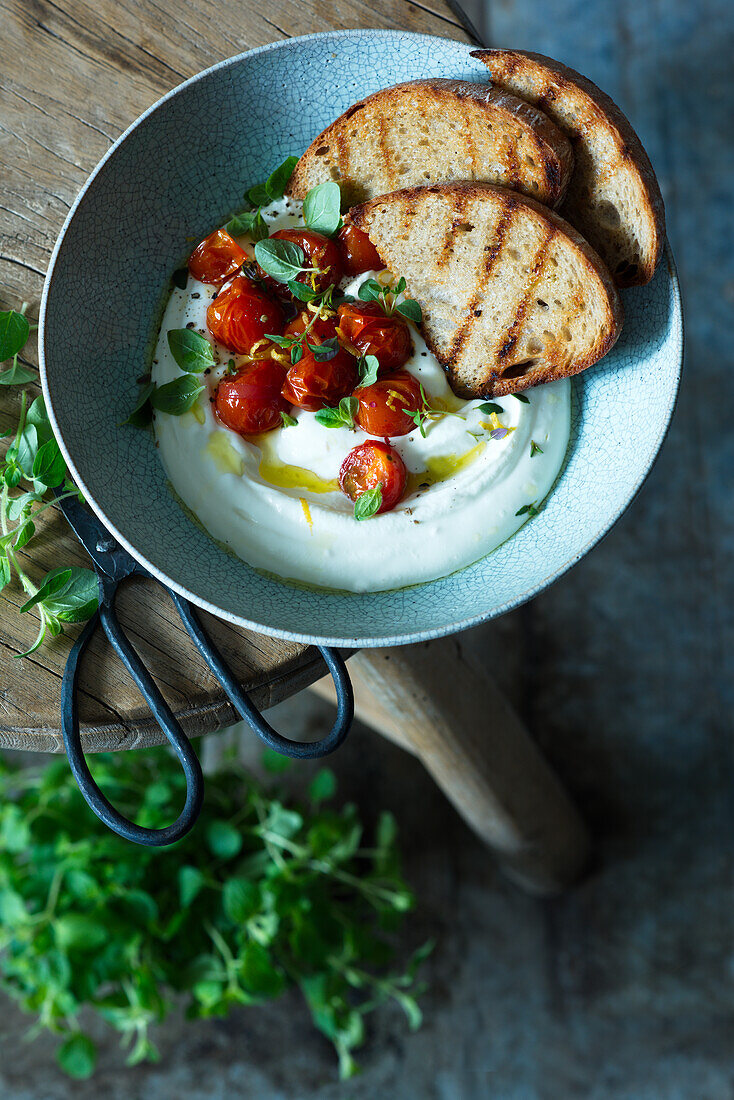 Cream of feta with roasted tomatoes and bread