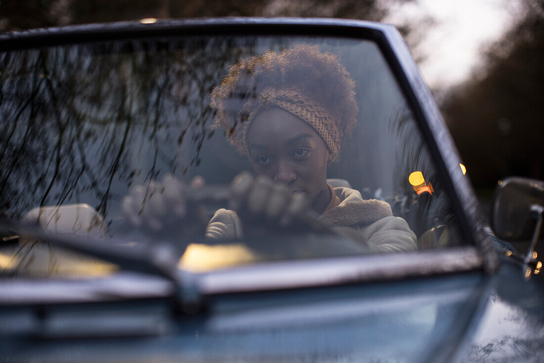 Young woman driving convertible