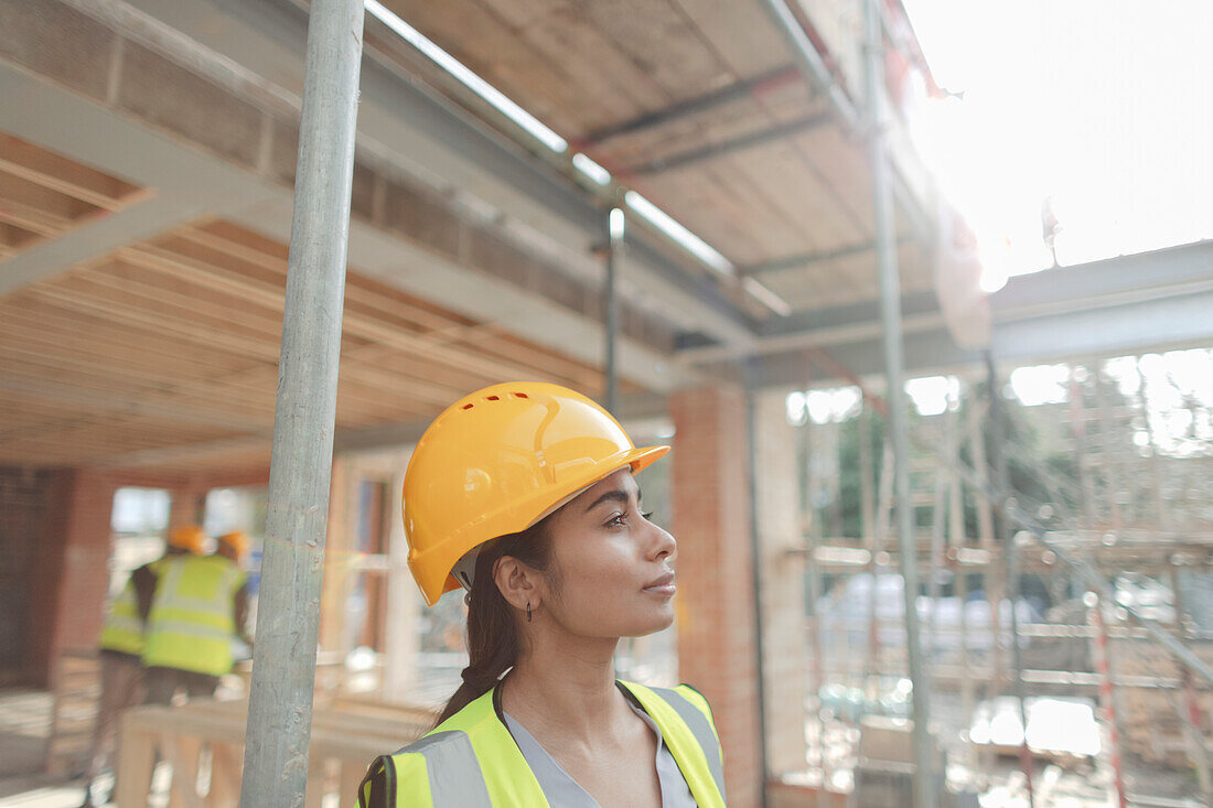Confident construction worker at construction site