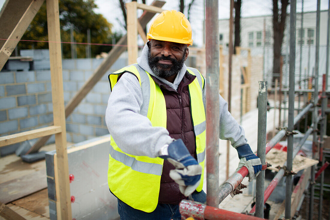 Confident construction worker at construction site