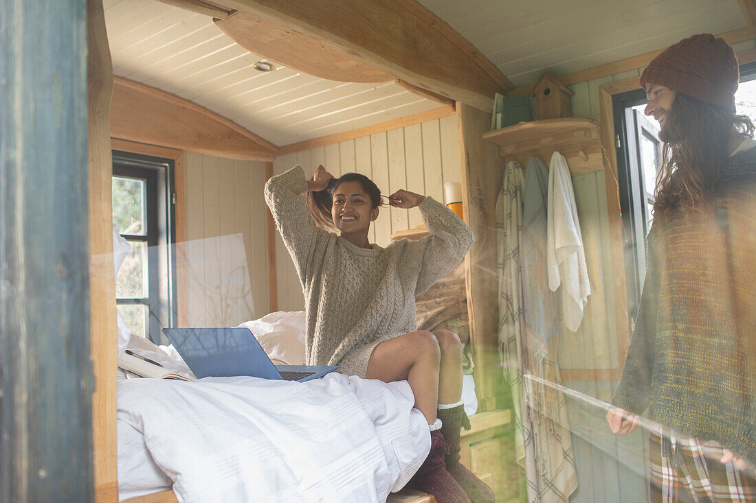 Carefree young couple in tiny cabin rental