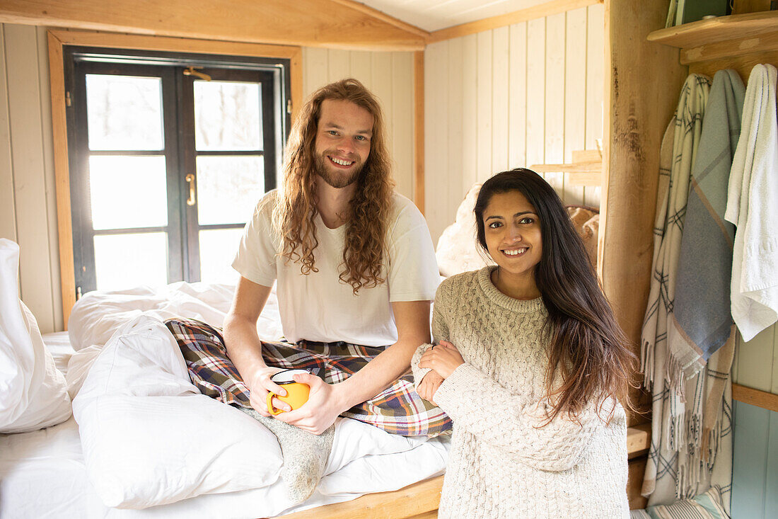 Happy young couple relaxing in cabin