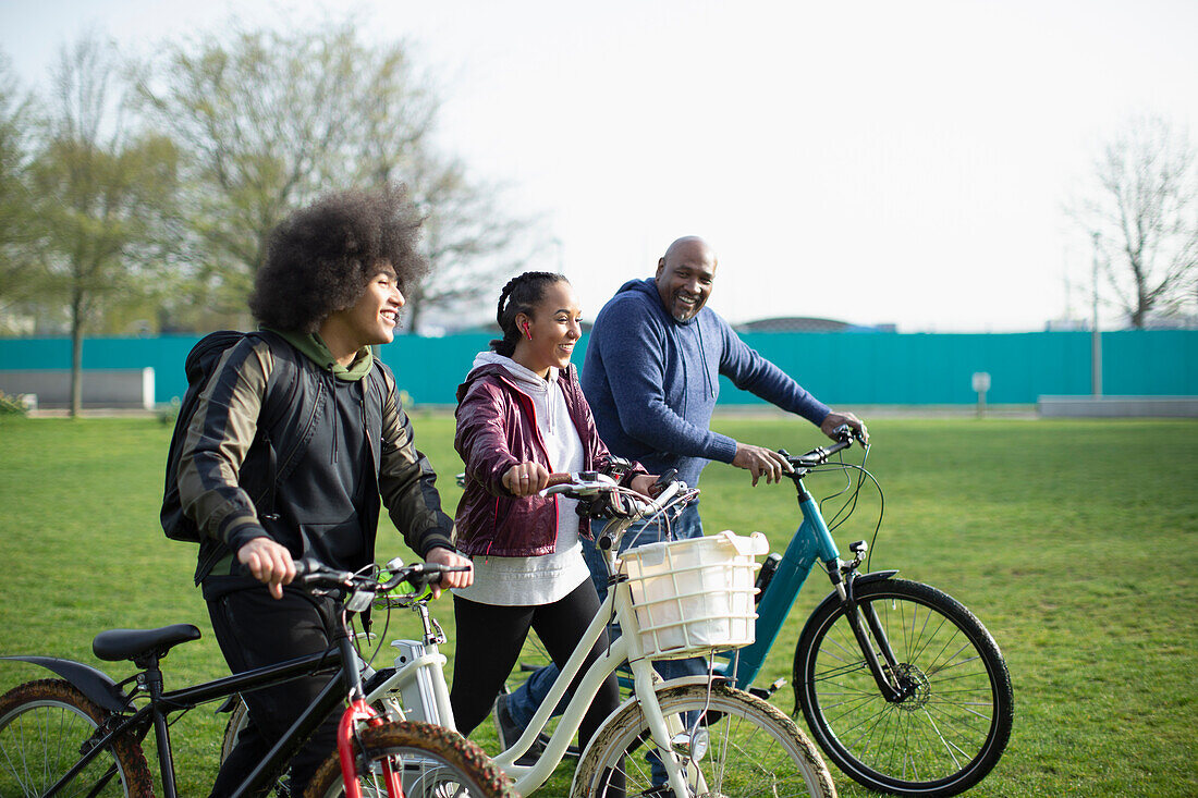 Family with bicycles in park