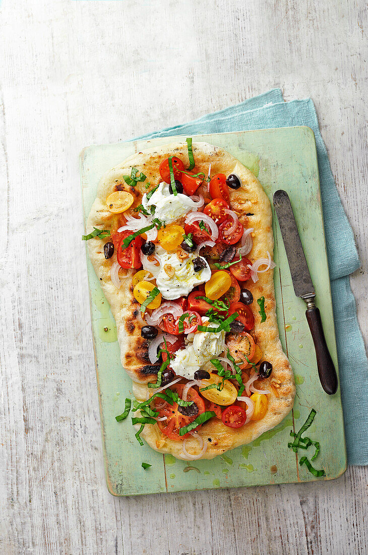 Garlic oil BBQ pizza with tomatoes, mozzarella and pickled shallot salad
