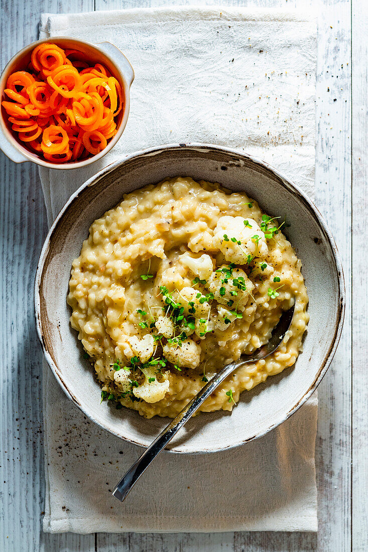 Creamy cauliflower risotto with white wine and carrot salad