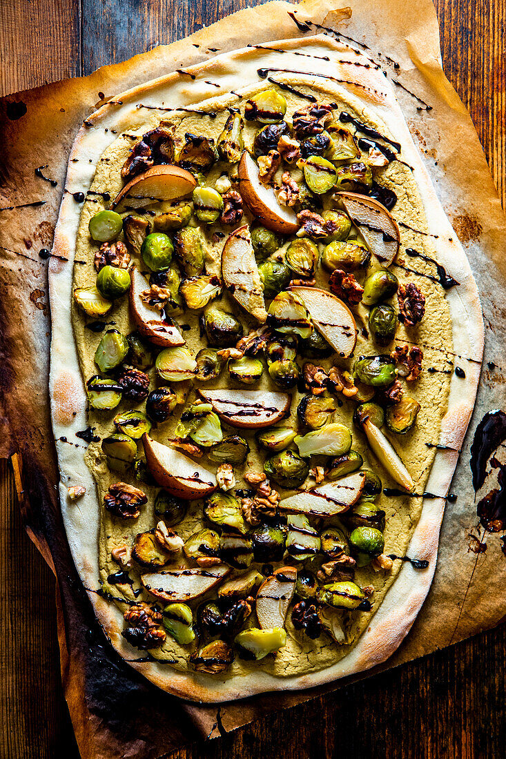 Hummus flambé with Brussels sprouts, pears, and walnuts