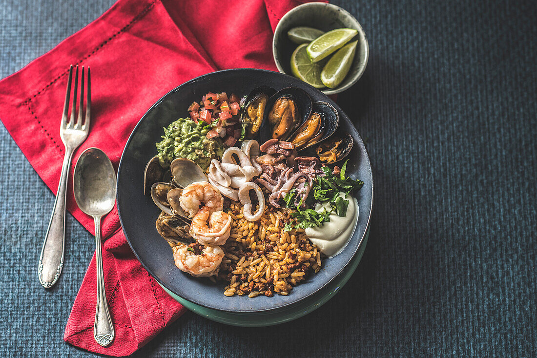 Seafood bowl with rice and avocado cream