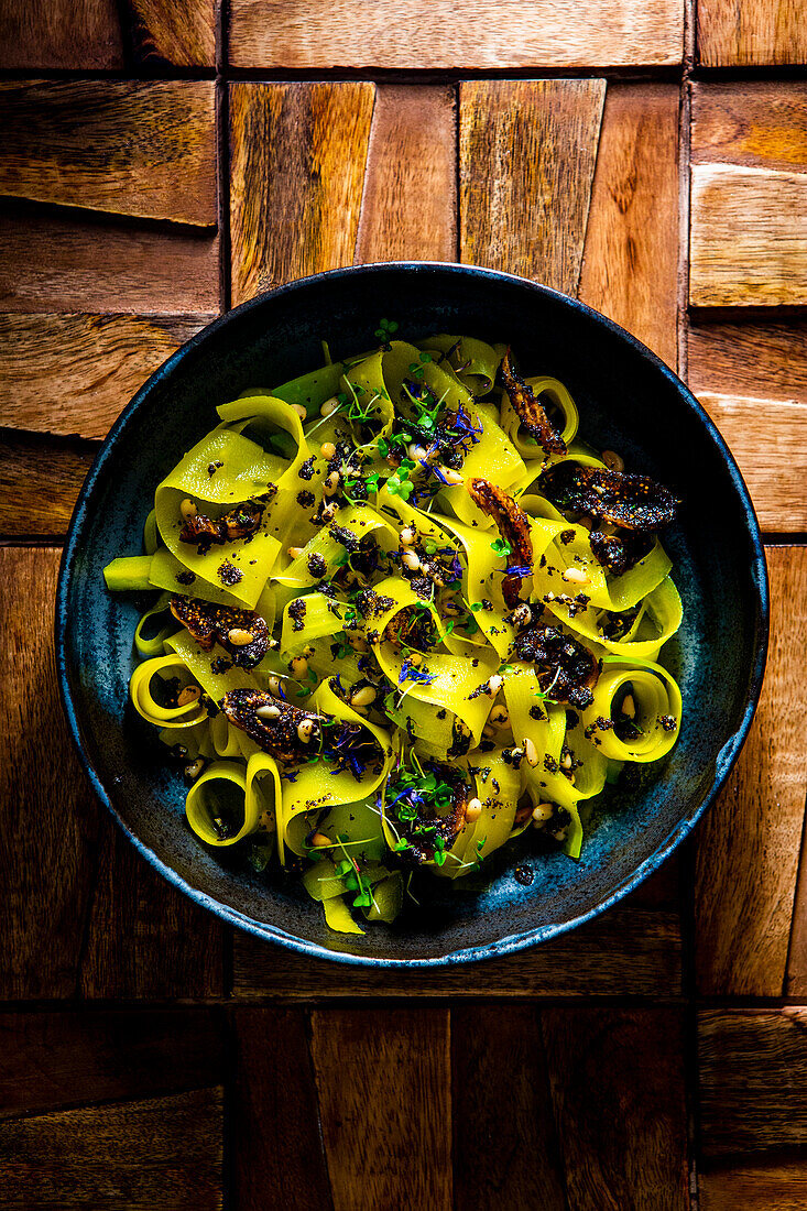Pasta of yellow beets with poppy seed balsamic sauce and figs
