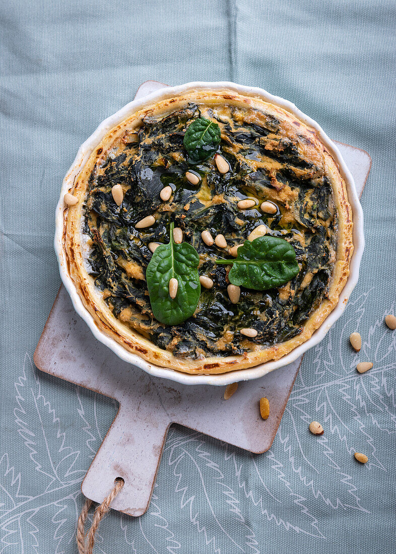 Vegan spinach quiche with pine nuts