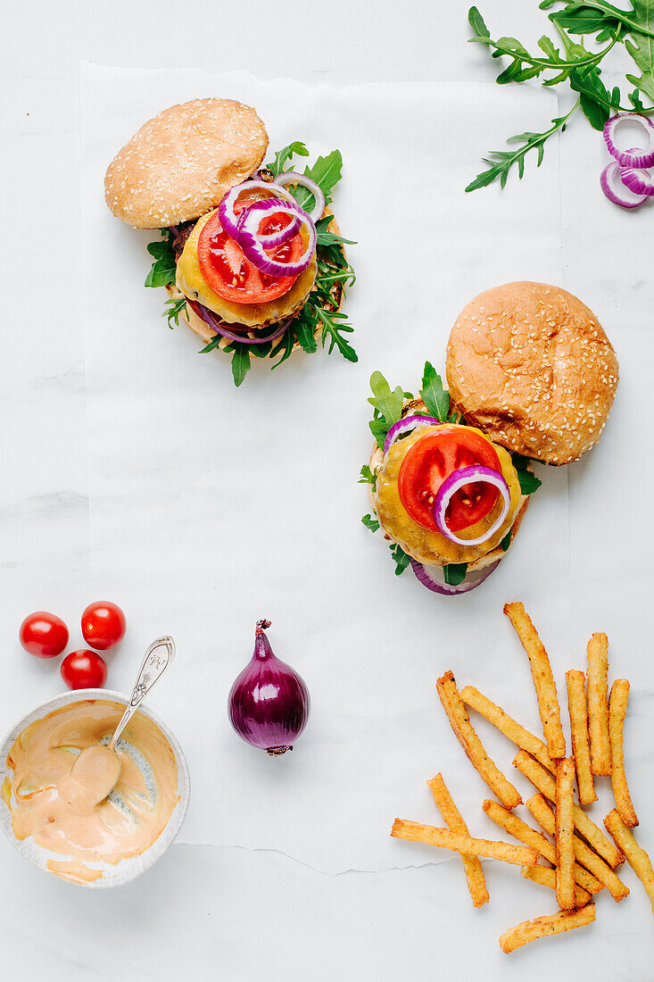 Veggie burgers with cheese and homemade chips