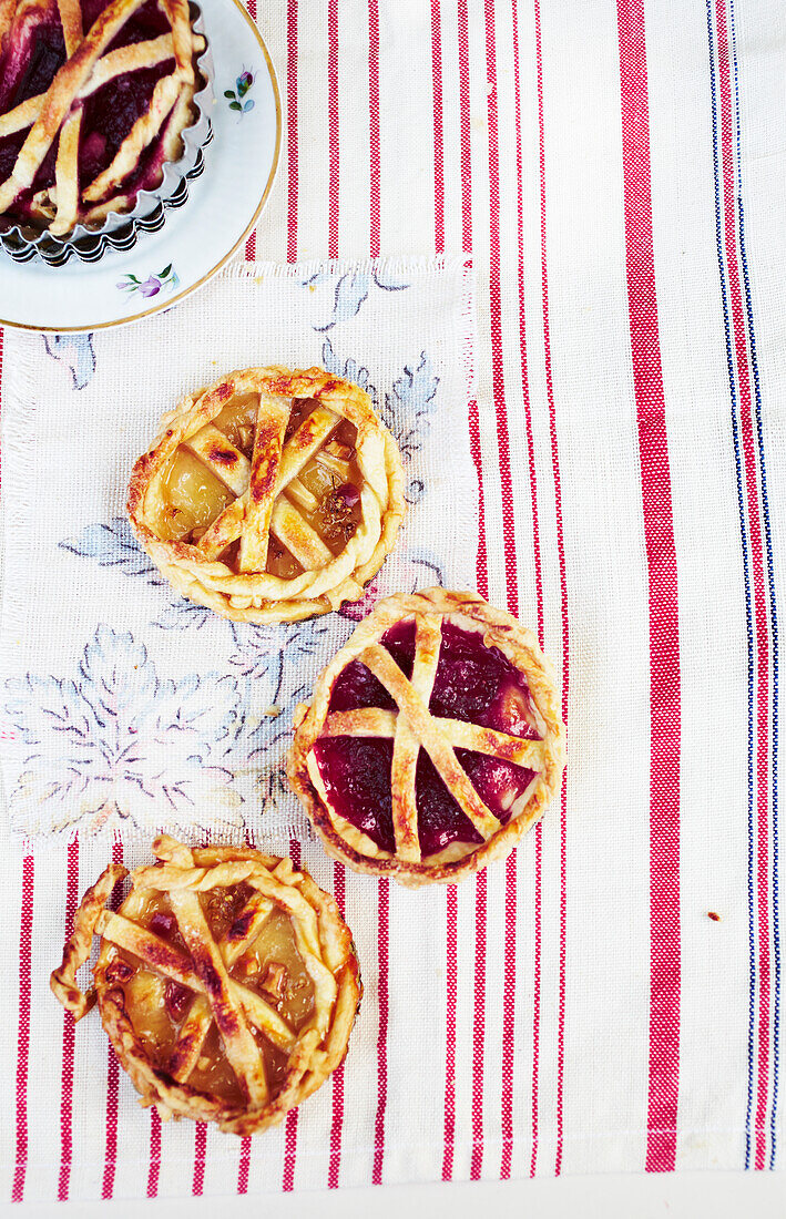 Puff pastry tartlets with elderflower jelly and strawberry jam