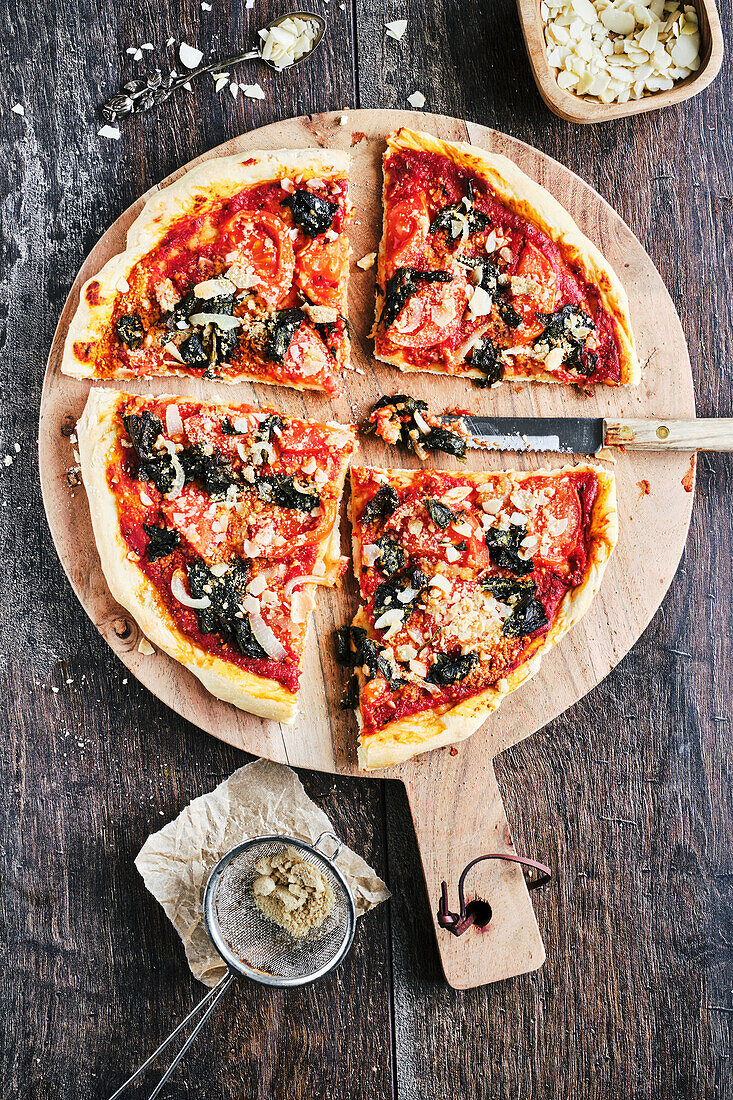 Vegan wild garlic pizza with parmesan substitute