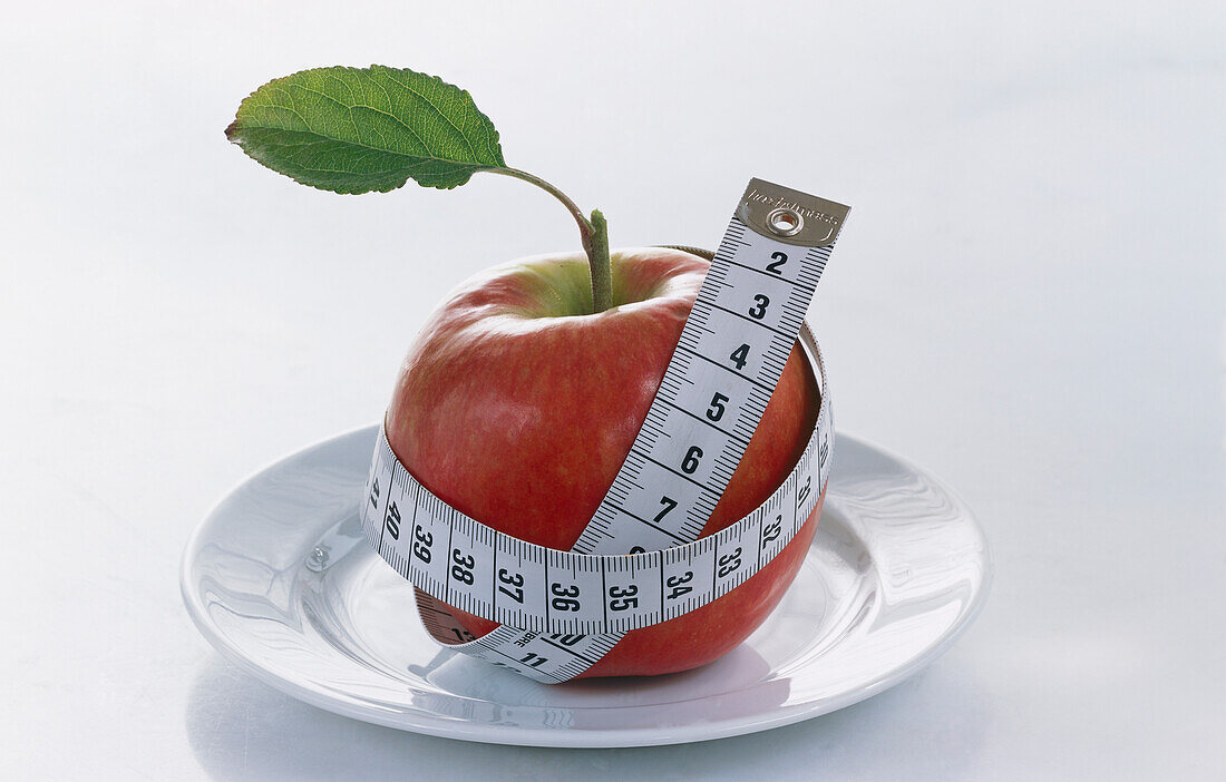 Apple with a measuring tape