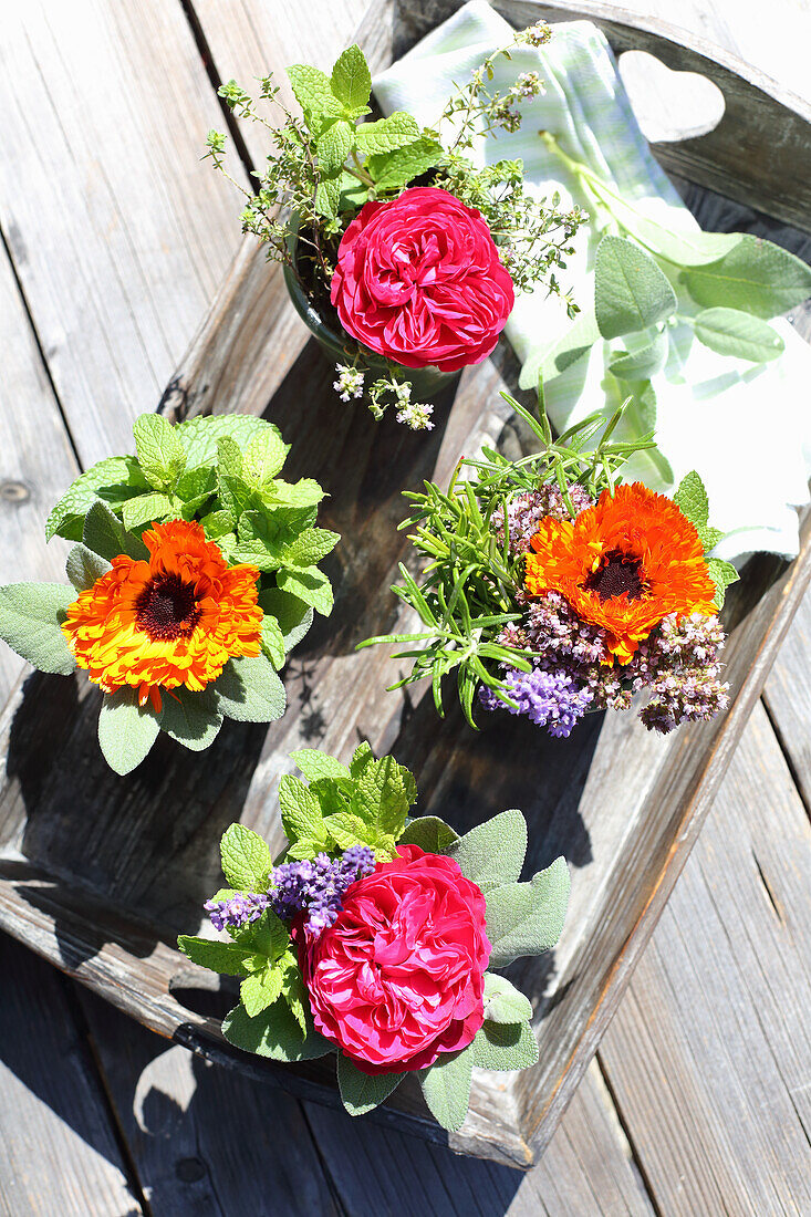 Posies of herbs, roses and marigolds