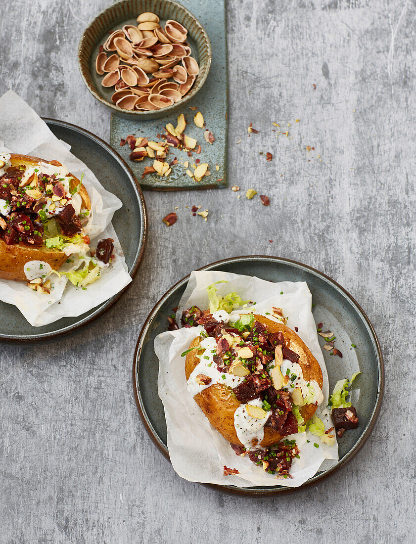 Vegan baked potato with beetroot salad and pistachios