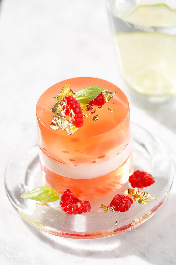 Iced flower raspberry and basil jelly with gold leaves