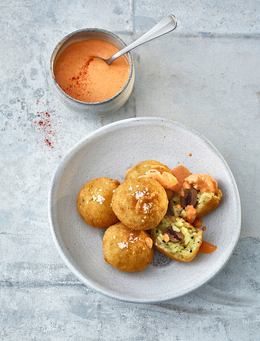 Crispy rice balls with a pepper dip