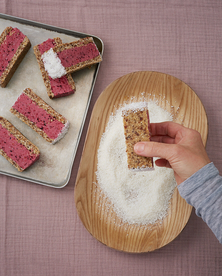 Vegan sour cherry ice cream sandwich with coconut flakes