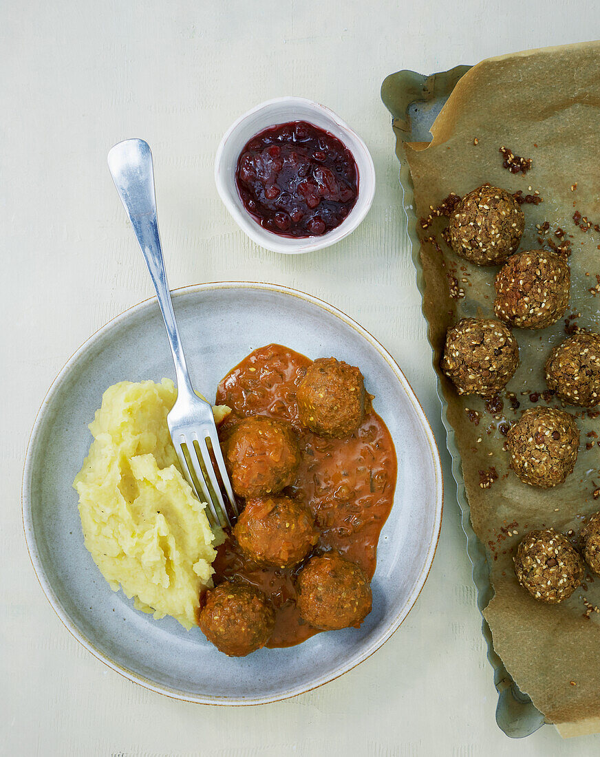 Vegan lentil meatballs with mashed potatoes and cranberries