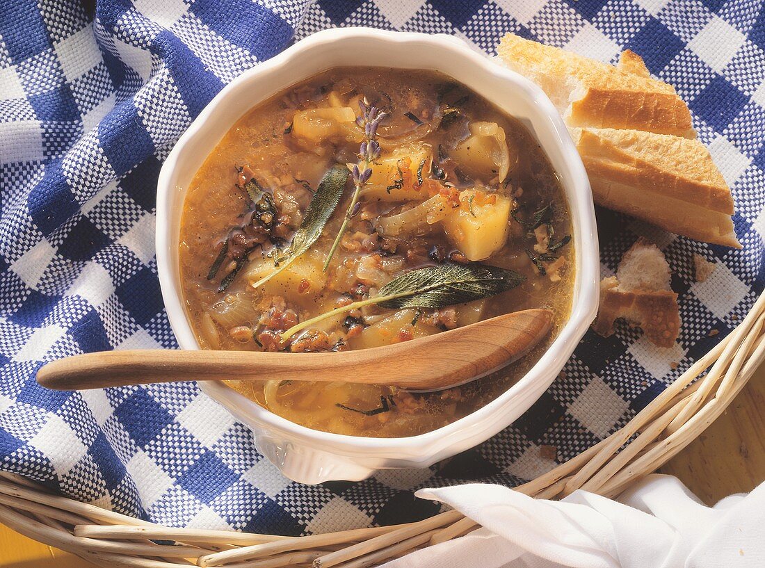 Onion soup with potatoes, bacon and sage