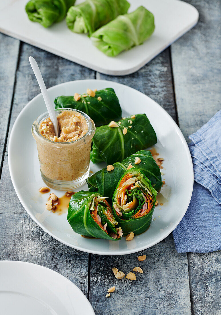 Pointed cabbage and ham rolls with peanut dip
