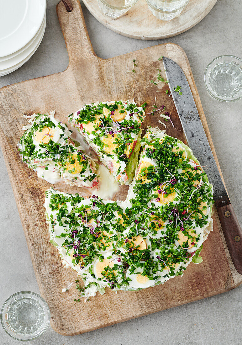 Cream cheese salad tart with eggs and sprouts