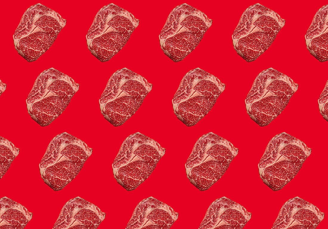 Raw Ribeye on red background