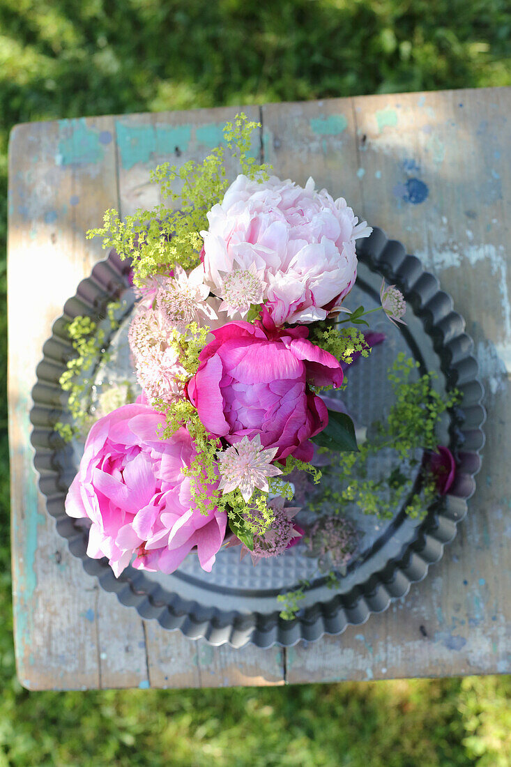 Peonies in cups