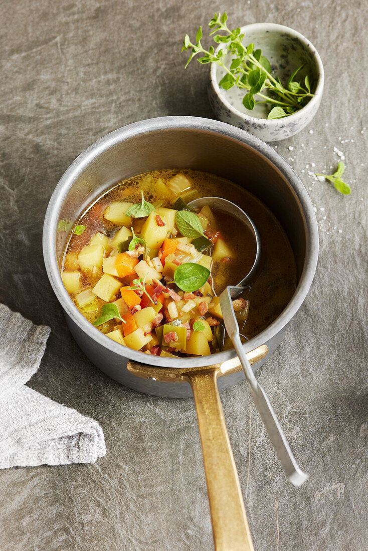Potato and vegetable stew with bacon