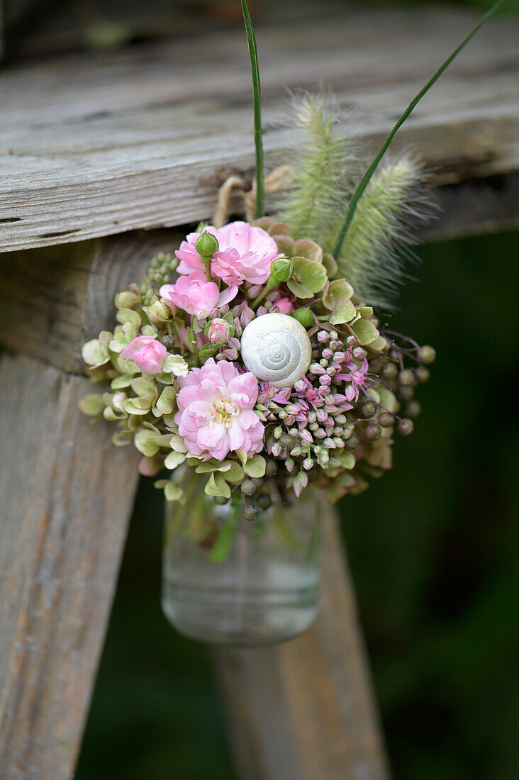 Posy of sedum, roses, elderberries and hydrangeas