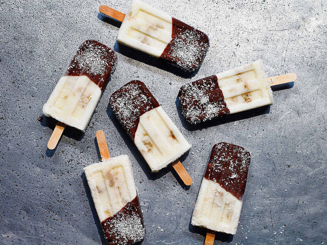 Coconut yogurt ice cream sticks with chocolate icing